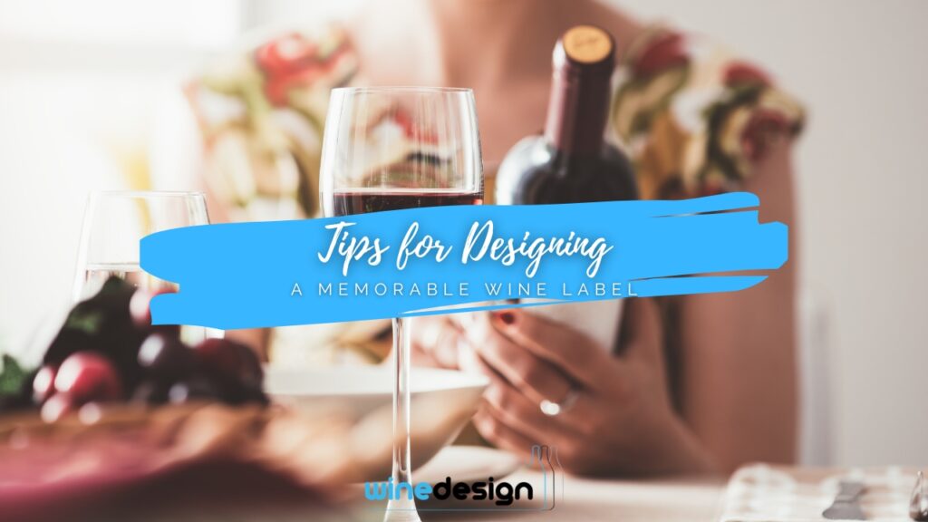 Blog - Corporate Wine Gifts A glass of red wine on a dining table with a blurred person holding a wine bottle in the background.